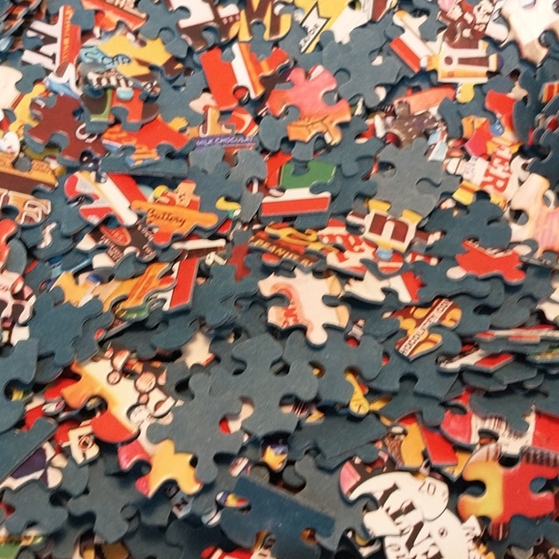 White Mountain Puzzles Candy Wrappers 1000 Piece Jigsaw Puzzle by Charle Girard