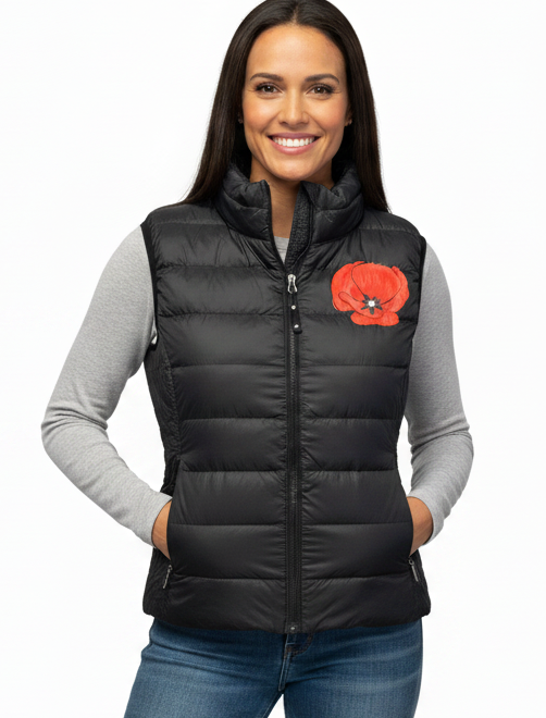 Smiling woman wearing the poppy puffer vest with a light gray undershirt